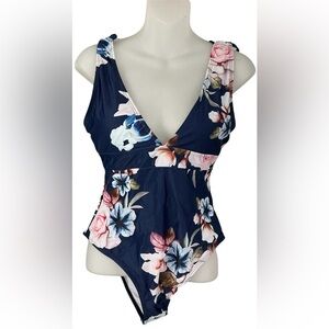 Veceney One Piece Swimsuit featuring a blue floral print and a high-cut design